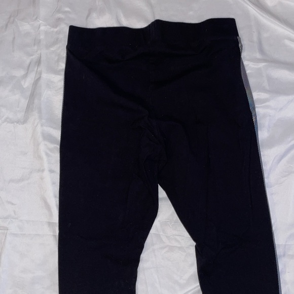 Torrid size 1X black leggings with iridescent dotted stripes on legs - Picture 4 of 4